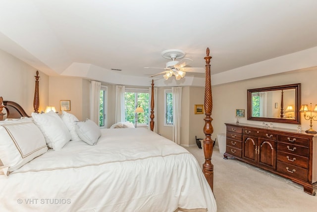 bedroom featuring ceiling fan and light colored carpet