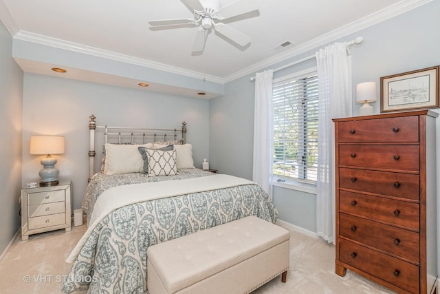 bedroom featuring light carpet, baseboards, visible vents, ceiling fan, and ornamental molding