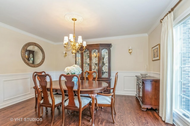 dining area featuring dark wood-type flooring, plenty of natural light, and a notable chandelier