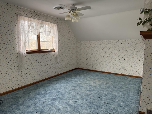 bonus room featuring a ceiling fan, visible vents, vaulted ceiling, and carpet flooring