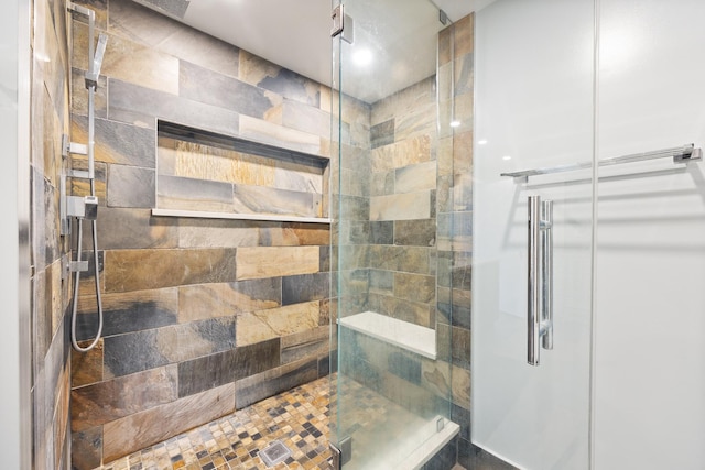 bathroom featuring a shower stall