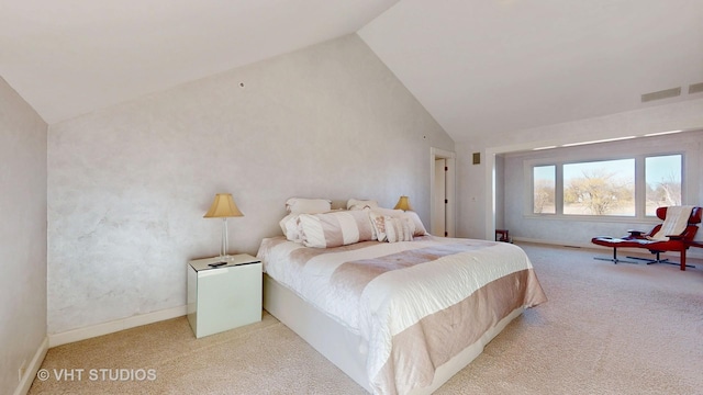 carpeted bedroom featuring high vaulted ceiling, visible vents, and baseboards