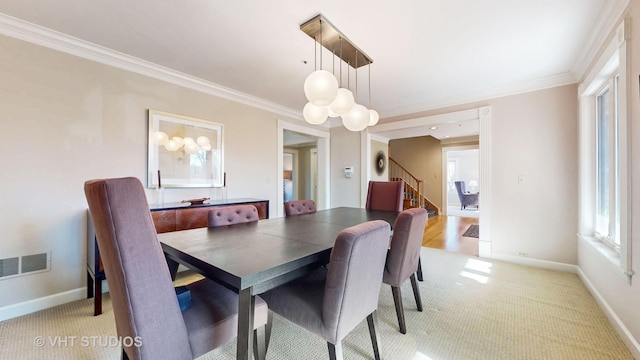 dining area featuring stairway, baseboards, visible vents, and ornamental molding