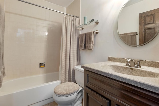 bathroom featuring toilet, shower / tub combo, and vanity