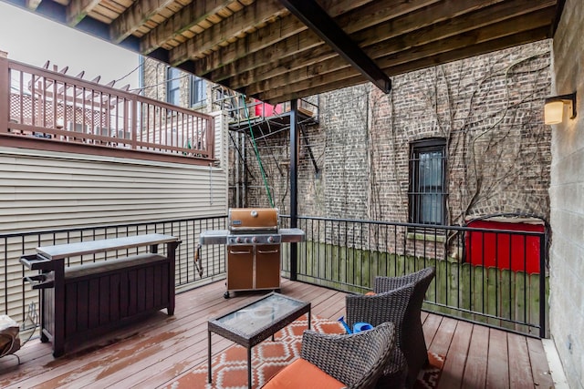 wooden deck with area for grilling