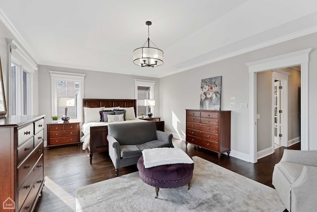 bedroom featuring baseboards, a chandelier, dark wood-type flooring, and ornamental molding