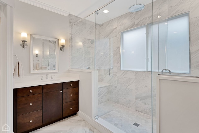 full bathroom with marble finish floor, ornamental molding, a shower stall, and vanity