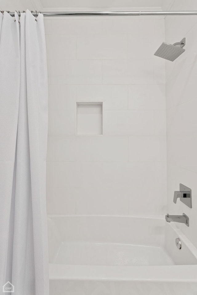 bathroom with shower / bath combination with curtain