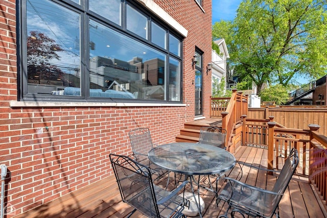 wooden deck with outdoor dining area