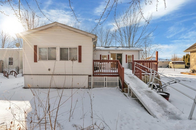 exterior space featuring a wooden deck