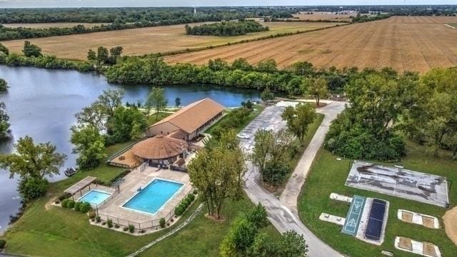 aerial view with a rural view and a water view