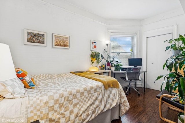 bedroom with wood finished floors