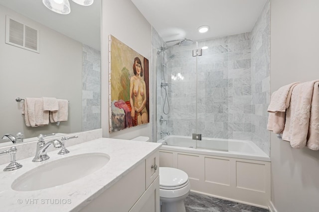 bathroom with washtub / shower combination, visible vents, vanity, and toilet