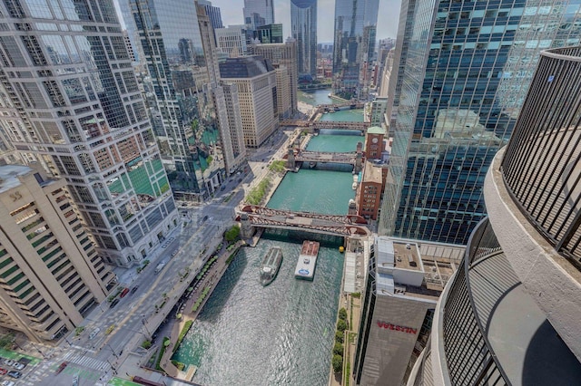 birds eye view of property featuring a view of city and a water view