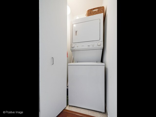 washroom with stacked washer and dryer