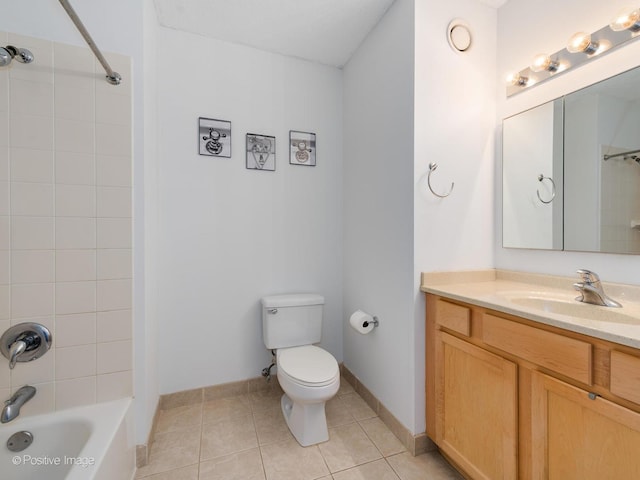 bathroom with baseboards, toilet, shower / bathing tub combination, tile patterned floors, and vanity