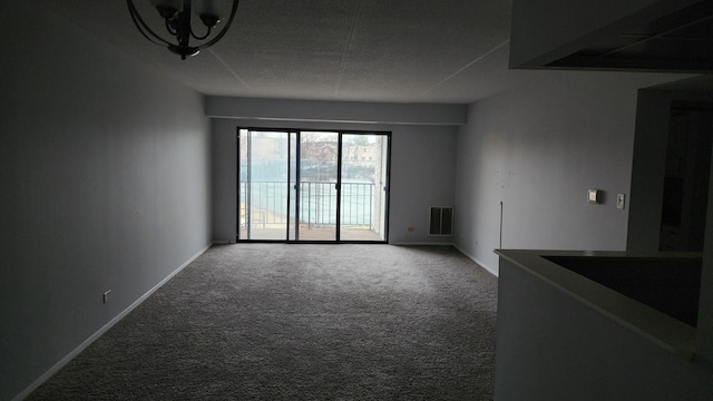 unfurnished living room featuring carpet flooring, baseboards, and visible vents