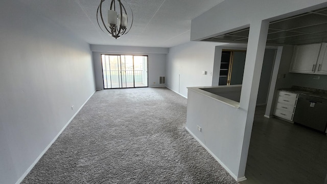 interior space featuring baseboards, visible vents, and dark carpet