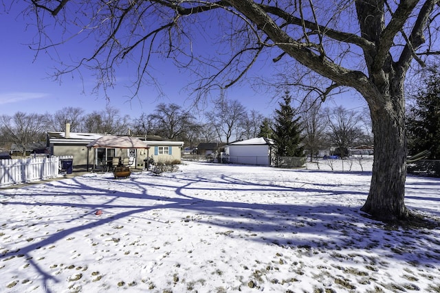 exterior space with a garage and a fenced backyard