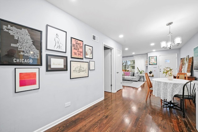 dining room with recessed lighting, visible vents, dark wood-type flooring, a chandelier, and baseboards