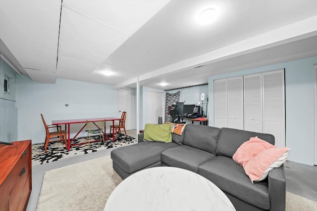 living area with concrete flooring