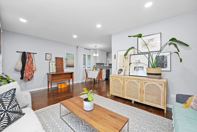 living room featuring dark wood-style floors, recessed lighting, and baseboards