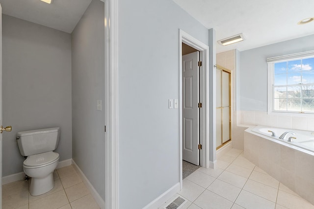 full bathroom featuring visible vents, toilet, a stall shower, tile patterned flooring, and a bath