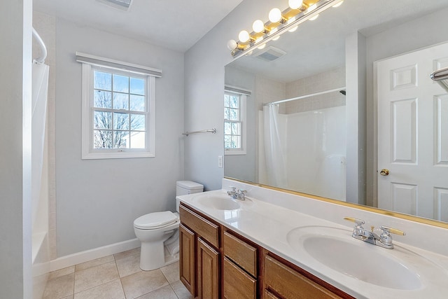 full bath featuring curtained shower, tile patterned flooring, and a sink