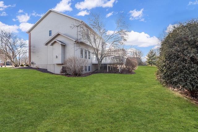 view of property exterior featuring a lawn