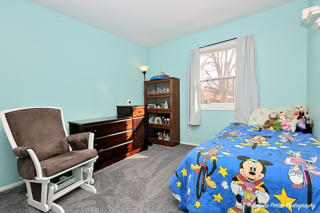 bedroom featuring baseboards and carpet flooring