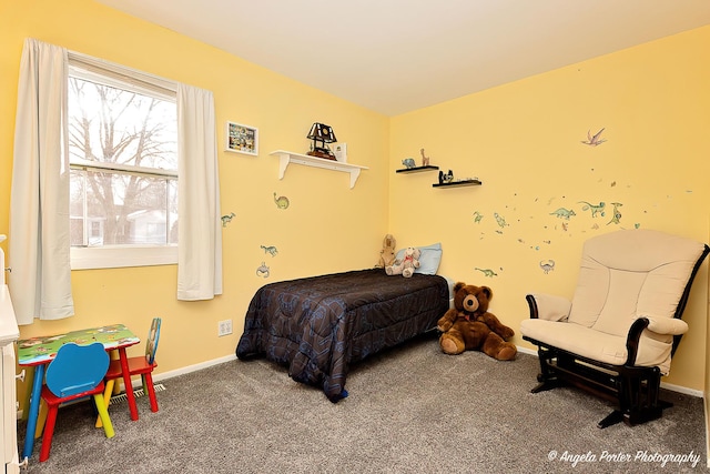 bedroom featuring baseboards and carpet flooring