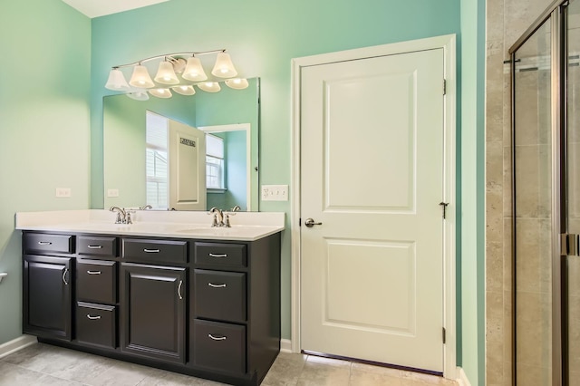 full bath with tile patterned floors, a sink, a shower stall, and double vanity