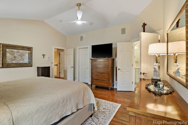 bedroom featuring a ceiling fan, lofted ceiling, dark wood-style flooring, and visible vents