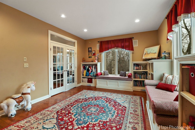 sitting room featuring visible vents, baseboards, wood finished floors, french doors, and recessed lighting