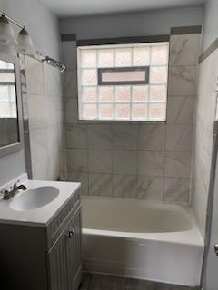 full bath with tub / shower combination and vanity