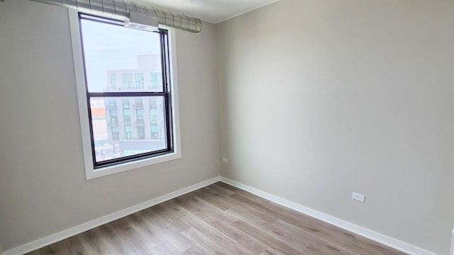 4015 N Milwaukee Ave Unit 516, Chicago, IL 60641 - unfurnished room with light wood finished floors and baseboards