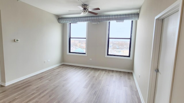 4015 N Milwaukee Ave Unit 516, Chicago, IL 60641 - spare room featuring light wood-type flooring, baseboards, and plenty of natural light