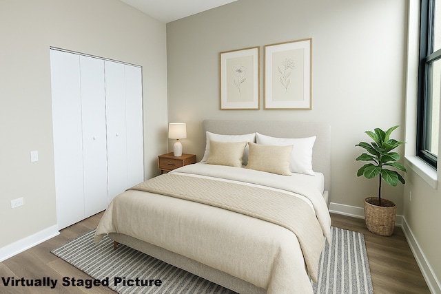 4015 N Milwaukee Ave Unit 516, Chicago, IL 60641 - bedroom with a closet, baseboards, and wood finished floors