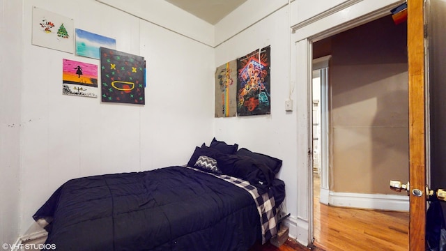 bedroom featuring wood finished floors