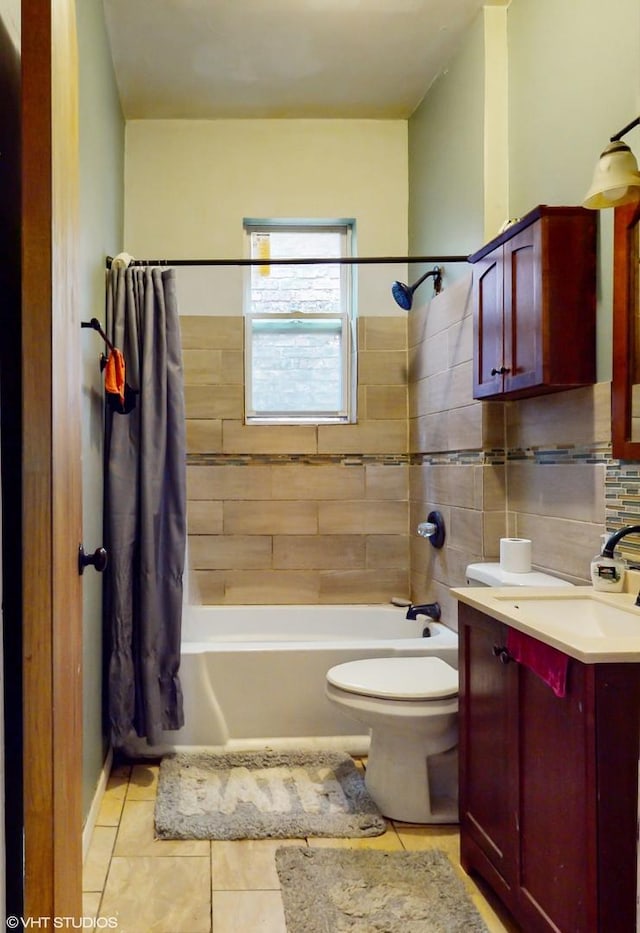 full bathroom featuring tasteful backsplash, toilet, shower / bathtub combination with curtain, tile patterned flooring, and vanity