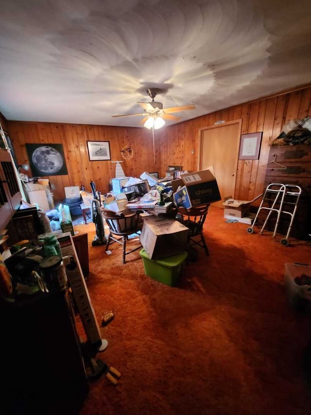 interior space with a ceiling fan and carpet flooring