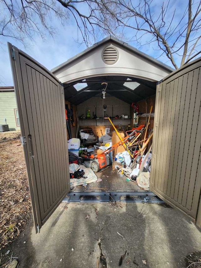 exterior space with a shed