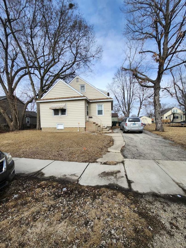 view of home's exterior with aphalt driveway