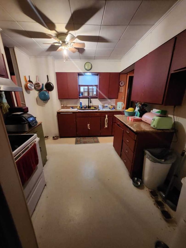 kitchen featuring ceiling fan, a sink, and white range with electric stovetop