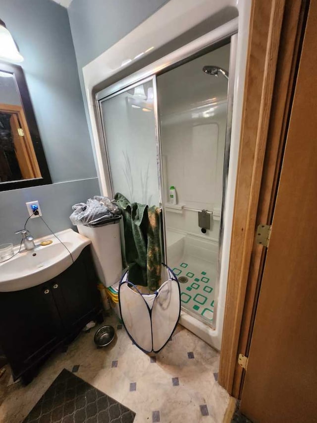 full bath featuring a shower stall and vanity