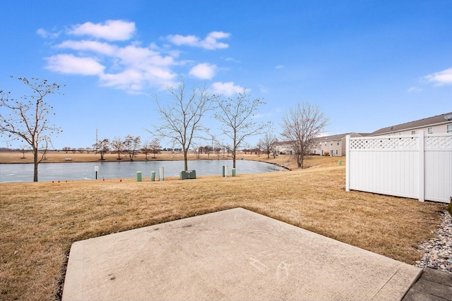 view of yard featuring a patio and a water view