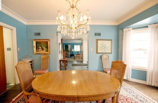 dining area with visible vents, plenty of natural light, and crown molding