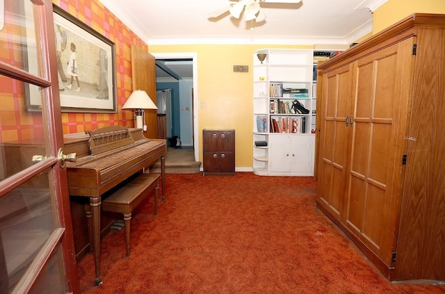 hall with carpet flooring, baseboards, and crown molding