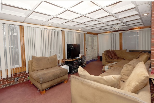 carpeted living room with coffered ceiling