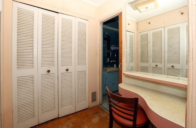 office space with visible vents and wood finished floors